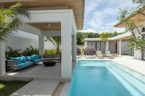 an image of a swimming pool in a house at Mouana Breeze Maikhao VIP 4-bedroom Pool Villa 9915 in Mai Khao Beach
