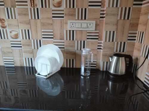 a table with a appliance on top of it at Samuels Comfort Homes in Bengaluru