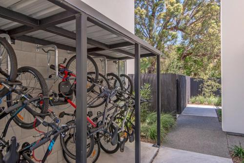 a group of bikes parked next to a building at 5 Minute Walk to Arena & Stadium in Christchurch