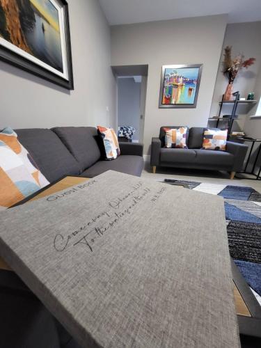 a living room with a couch and a table at Old Market Street in Sligo