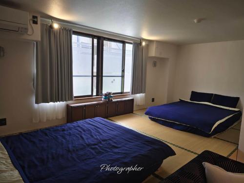 Postel nebo postele na pokoji v ubytování Guest House WA