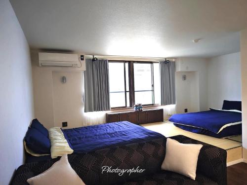 Postel nebo postele na pokoji v ubytování Guest House WA