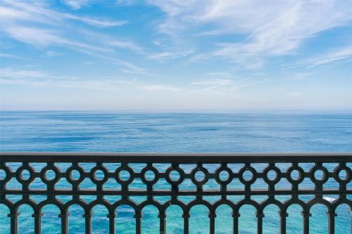 a view of the ocean from a balcony at Kempinski Hotel Cancun in Cancún