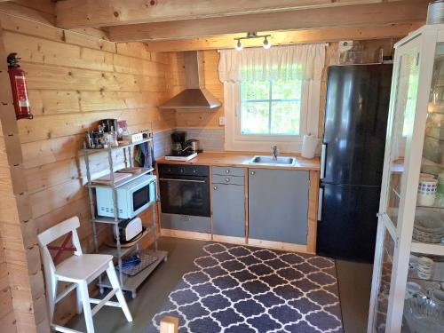 Kuchyň nebo kuchyňský kout v ubytování Fröya Timber Cottage