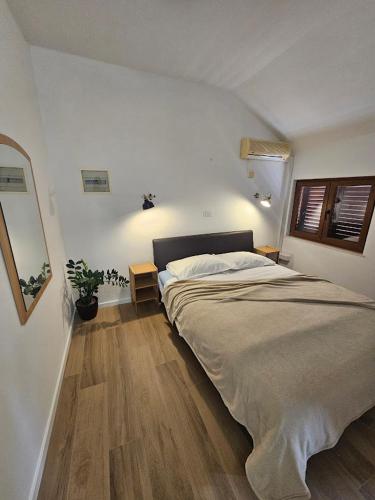 a bedroom with a large bed in a room at Villa Lovor in Zaton
