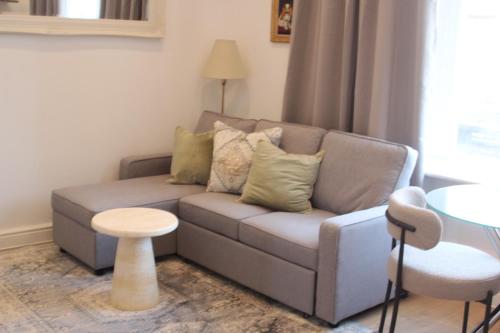 a living room with a couch and a table at River bridge in Luton