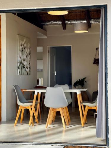 a dining room with a table and chairs at Rosetta Fields Country Lodge in Rosetta