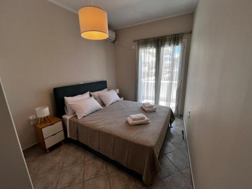 Ένα ή περισσότερα κρεβάτια σε δωμάτιο στο Eva sea view apartment Xylokastro