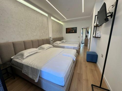 Postel nebo postele na pokoji v ubytování Hotel Europa Kruje