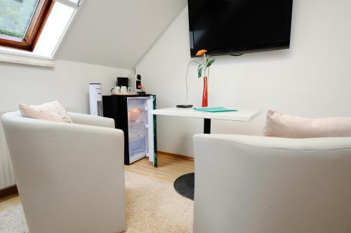 TV a/nebo společenská místnost v ubytování Zimmer u Apartment in Bad Gams Deutschlandsberg