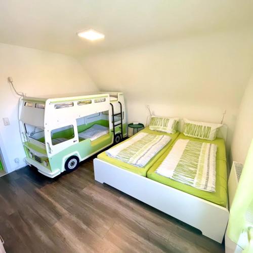 a bedroom with two beds and a van in it at Ferienwohnung Seehas am Bodensee in Friedrichshafen