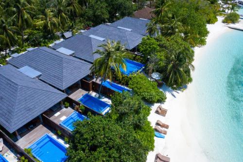 an aerial view of a resort with swimming pools and the beach at Lily Beach Resort and Spa - All Inclusive in Dhangethi