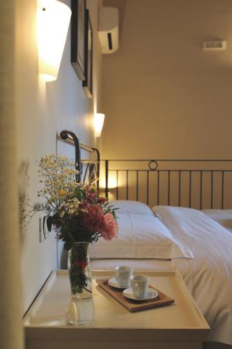 Una cama o camas en una habitación de Il Bottone D'Argento