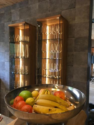a bowl of fruit in front of a refrigerator at Chalet Tannweg In Sankt Johann In Tirol in Alpendorf