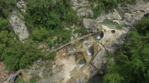 an aerial view of a river on a rocky mountain at Stone House Kotli in Kotli