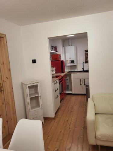 a room with a kitchen and a living room at Bergblick in Königstein an der Elbe