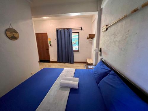 Postel nebo postele na pokoji v ubytování Island Lyfe Adventures Hotel