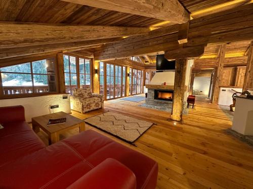 a living room with a couch and a fireplace at Panoramasuite in Flattach