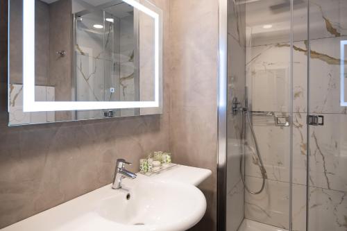 a bathroom with a sink and a shower at Hotel Dei Congressi in Rome