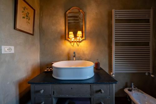 a bathroom with a large tub on a table at L'imbrunire in Campiglia dʼOrcia