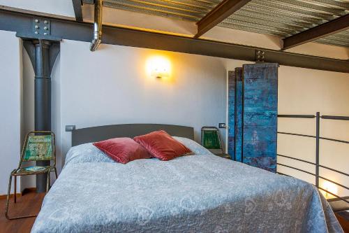 Postel nebo postele na pokoji v ubytování La Filanda: Loft