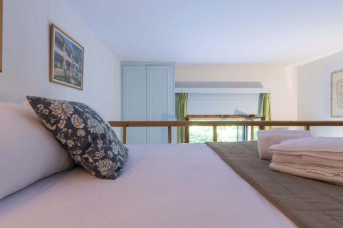 Giường trong phòng chung tại Italian Experience-Suite Vogel