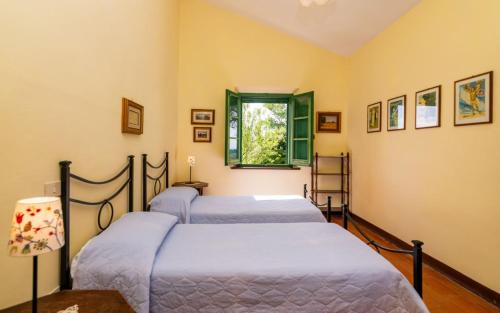 Postel nebo postele na pokoji v ubytování Agriturismo La Godiola