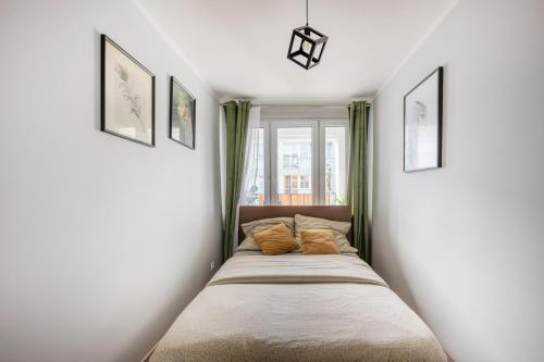 En eller flere senge i et værelse på WroStay Kuźnicza