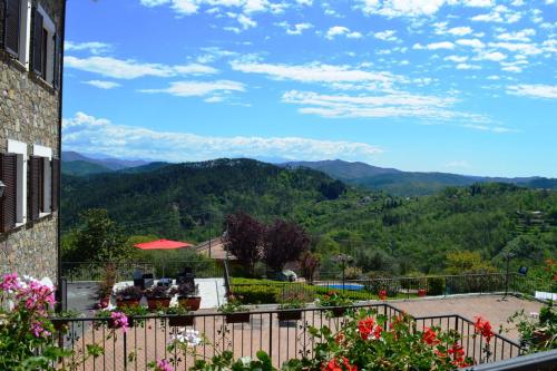 a view of the mountains from the balcony of a house at Antiche Terre Hotel & Relax in Pignone