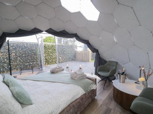 a bedroom with a bed in a tent at Number 1 Dome in Doirí Beaga