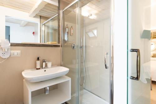 a bathroom with a sink and a shower at Santo Stefano Home & Breakfast in Polignano a Mare