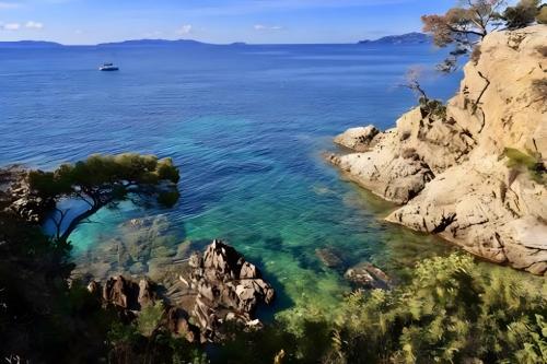 a view of the ocean from a rocky cliff at Chez Lina in Le Lavandou