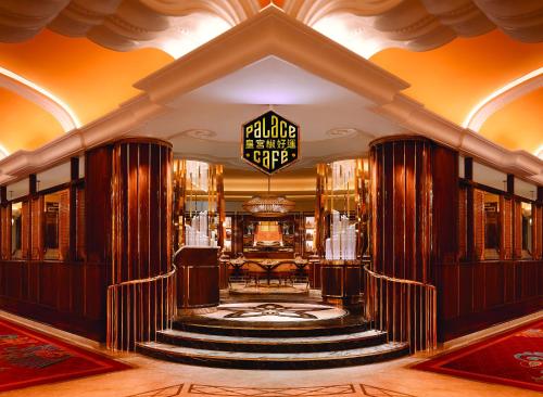a lobby of a hotel with a spiral staircase at Wynn Palace in Macau
