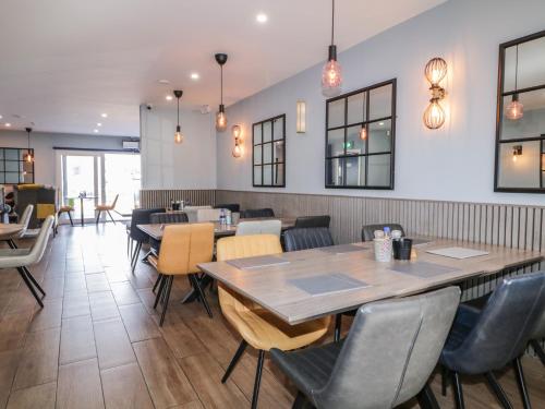 a dining room with a table and chairs at Number 2 Dome in Doirí Beaga