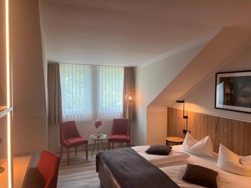 Postel nebo postele na pokoji v ubytování Atrium Hotel Krüger