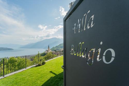 a sign for a building with a view of a lake at Valarin Luxury Apartments & Wellness, Vercana by Rent All Como in Vercana