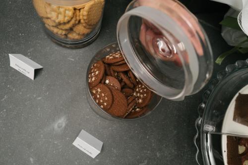 a table with a jar of cookies and a bowl of chips at Ventus Park Hotel in Nago-Torbole