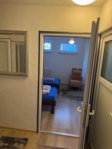 a room with a door open to a living room at Cäsar's Motel in Hagenbrunn