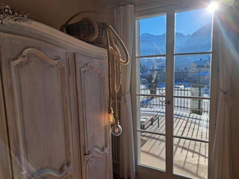 a room with a window with a view of a balcony at VILLA Turmmattli in Sarnen
