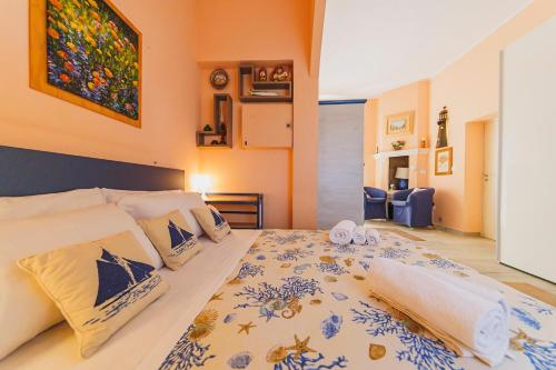 a bedroom with a large bed in a room at Casa a *POLIGNANO* con [Affaccio sul Mare] in Polignano a Mare