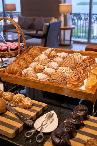 a display of pastries and breads on a table at Kempinski Hotel Cancun in Cancún