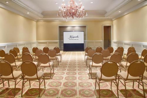 a conference room with a stage and a screen at Kempinski Hotel Cancun in Cancún