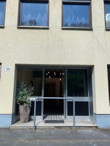an open door of a building with a staircase at Factory Loft Eifel in Leimbach