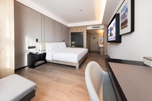 Ένα ή περισσότερα κρεβάτια σε δωμάτιο στο Atour Hotel Xian Greater Wild Goose Pagoda