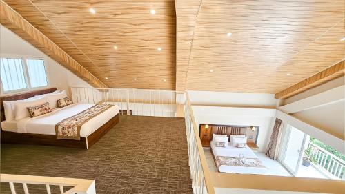 Postel nebo postele na pokoji v ubytování Yashshree Resorts & Spa Kalimpong