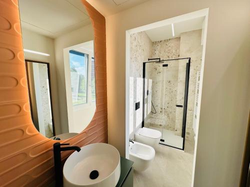 a bathroom with a sink and a mirror at Airport Linate Residence in Milan