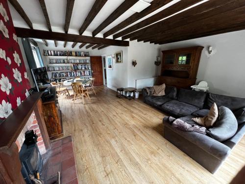 a living room with a couch and a table at Wellbet Farm in Swinderby