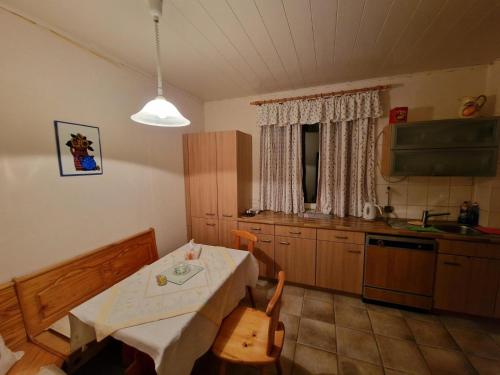 a kitchen with a table and chairs in a room at Messe Apartments Hannover in Hannover