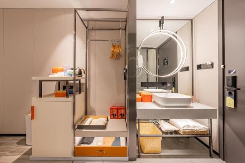 a bathroom with a sink and a mirror at Atour Hotel Beijing Tiananmen Wangfujing Pedestrian in Beijing