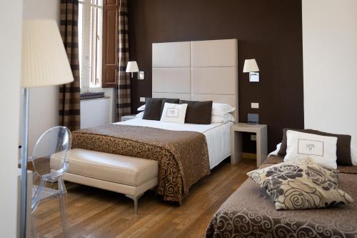 Katil atau katil-katil dalam bilik di Suite 70 Luxury Collection